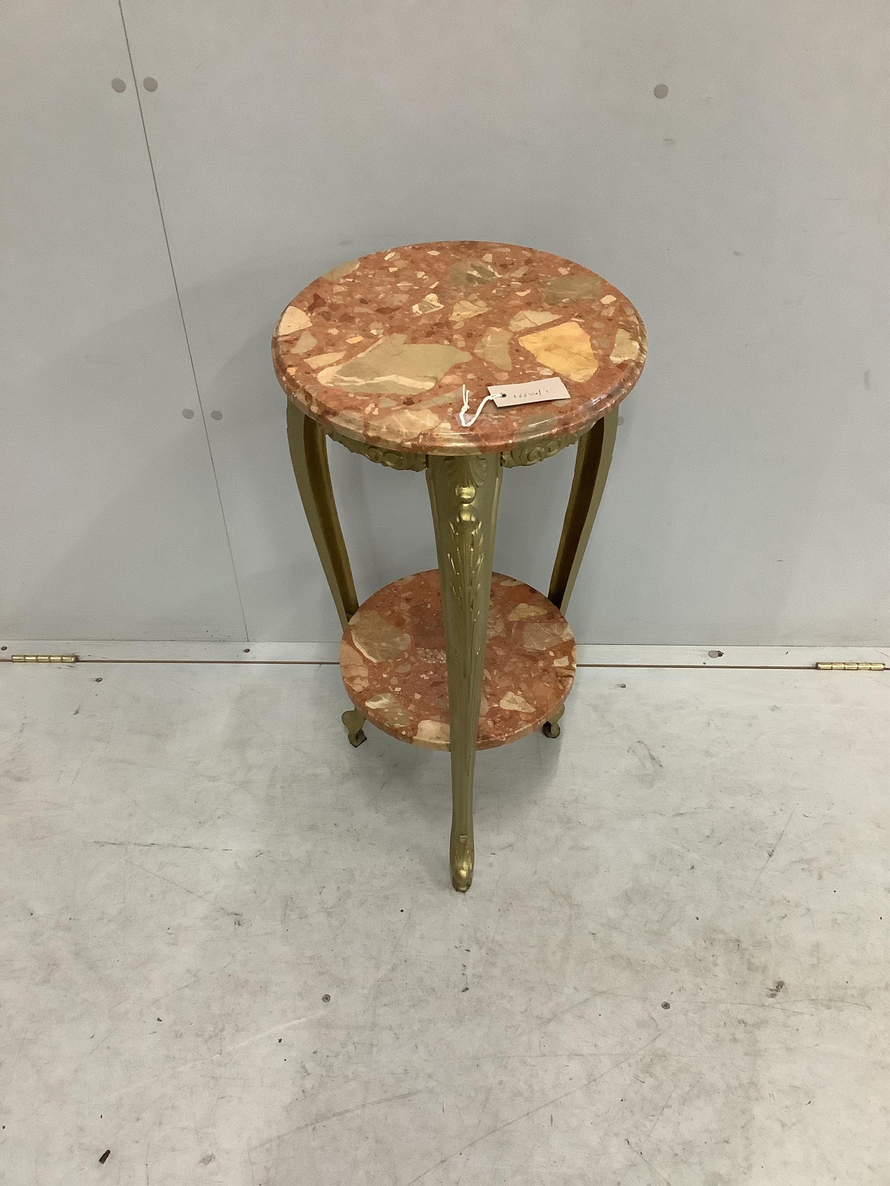 An early 20th century French circular reconstituted marble and cast metal two tier table, diameter 38cm, height 79cm. Condition - good